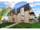 Beautiful exterior elevation of apartment building showcasing architectural details and manicured landscaping at 7615 E Quincy Ave # 103, Denver, CO 80237