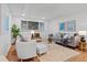 Bright living room with neutral tones and comfortable seating at 7615 E Quincy Ave # 103, Denver, CO 80237