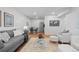 Open concept living room showcasing the kitchen, dining area, and seating at 7615 E Quincy Ave # 103, Denver, CO 80237
