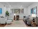 Stylish living room with modern furnishings and a large window at 7615 E Quincy Ave # 103, Denver, CO 80237