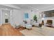 Well-lit living room features comfortable seating and an attached bathroom at 7615 E Quincy Ave # 103, Denver, CO 80237