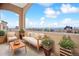 Inviting outdoor balcony furnished with a loveseat and chairs at 2200 S University Blvd # 514, Denver, CO 80210