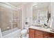 Bright bathroom with granite countertops and glass shower door at 2200 S University Blvd # 514, Denver, CO 80210
