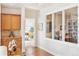 Hallway leading to bedroom, featuring hardwood floors and display cabinet at 2200 S University Blvd # 514, Denver, CO 80210