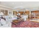 Inviting living room featuring plush seating, stylish decor, and open access to the kitchen area at 2200 S University Blvd # 514, Denver, CO 80210