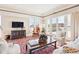 Bright living room with large windows, comfortable seating, and stylish decor at 2200 S University Blvd # 514, Denver, CO 80210