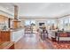 Spacious living room with modern kitchen featuring a large kitchen island and beautiful view at 2200 S University Blvd # 514, Denver, CO 80210