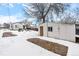 Backyard view with shed and snowy ground at 5454 Clay St, Denver, CO 80221