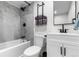 Clean bathroom with a white vanity, toilet, and shower/tub combo at 5454 Clay St, Denver, CO 80221