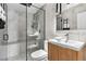 Spa-like bathroom with walk-in shower and modern vanity at 5454 Clay St, Denver, CO 80221