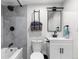 Clean bathroom with a white vanity, toilet, and shower/tub combo at 5454 Clay St, Denver, CO 80221