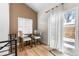 Small dining area with a table and three chairs, near sliding door at 5454 Clay St, Denver, CO 80221