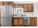 Updated kitchen with stainless steel appliances and wood cabinets at 5454 Clay St, Denver, CO 80221