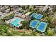 Aerial view of community amenities featuring a pool, tennis courts, and sand volleyball court at 7836 S Fairfax Ct, Centennial, CO 80122