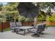 Swivel chairs surrounding a modern fire pit, perfect for outdoor gatherings and relaxation at 7836 S Fairfax Ct, Centennial, CO 80122
