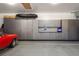 Organized garage with custom cabinets provides ample storage space for vehicles and equipment at 7836 S Fairfax Ct, Centennial, CO 80122