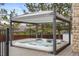 Relax in this covered hot tub on a wood deck, perfect for outdoor enjoyment and privacy at 7836 S Fairfax Ct, Centennial, CO 80122