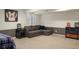 Comfortable living room with stylish decor including sectional sofa, side table, and sports memorabilia at 7836 S Fairfax Ct, Centennial, CO 80122