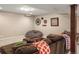 Cozy living room features a large comfortable sofa and a relaxing bean bag chair for lounging at 7836 S Fairfax Ct, Centennial, CO 80122