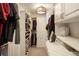 Spacious walk-in closet with custom shelving, drawers, cabinetry, and storage to keep things organized at 7836 S Fairfax Ct, Centennial, CO 80122