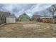 Large backyard featuring grass, a storage shed, and a wooden fence at 3640 Elm St, Denver, CO 80207