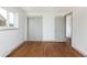 Bedroom features a double closet, hardwood floors, and fresh white paint at 3640 Elm St, Denver, CO 80207