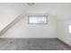 Bedroom featuring carpeted floors, neutral paint, and window at 3640 Elm St, Denver, CO 80207