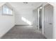 Bedroom featuring carpeted floors, neutral paint, and closet at 3640 Elm St, Denver, CO 80207