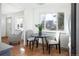 Cozy dining area with modern furniture and a bright window overlooking the outdoors at 3640 Elm St, Denver, CO 80207