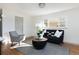 Inviting living room with a modern sofa, stylish accents, and ample natural light at 3640 Elm St, Denver, CO 80207