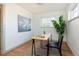 Comfortable office space with hardwood floors, neutral walls, a window, and stylish art at 3640 Elm St, Denver, CO 80207