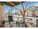 Charming balcony with table and chairs, perfect for outdoor dining, and surrounded by greenery at 12151 Melody Dr # 202, Westminster, CO 80234