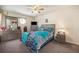 Comfortable bedroom with a queen bed, two nightstands, dresser, and ample natural light at 12151 Melody Dr # 202, Westminster, CO 80234