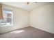 Clean bedroom with neutral carpet, natural light, and simple design providing versatile space at 12151 Melody Dr # 202, Westminster, CO 80234