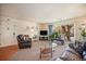 Comfortable living room featuring a sliding glass door, plush furnishings, and ample natural light at 12151 Melody Dr # 202, Westminster, CO 80234