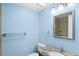 Bathroom featuring modern fixtures, granite countertop, and decorative mirror at 7877 E Mississippi Ave # 1107, Denver, CO 80247