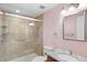 Well-lit bathroom featuring a shower with glass door and neutral color scheme at 7877 E Mississippi Ave # 1107, Denver, CO 80247