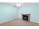 A carpeted bedroom featuring a fireplace, ceiling fan, and light blue walls at 7877 E Mississippi Ave # 1107, Denver, CO 80247