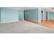 A bright and open living room with hardwood floors and light blue walls at 7877 E Mississippi Ave # 1107, Denver, CO 80247