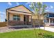 Beautiful home with a cozy porch and a well-manicured lawn, offering a welcoming and picturesque setting at 845 Leeward St, Lochbuie, CO 80603