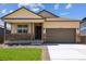 Charming single-Gathering home with a covered front porch and a two-car garage, showcasing great curb appeal at 845 Leeward St, Lochbuie, CO 80603