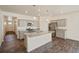 Modern kitchen featuring granite countertops, stainless steel appliances and gray cabinets at 845 Leeward St, Lochbuie, CO 80603