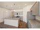 Modern kitchen featuring granite countertops, stainless steel appliances and gray cabinets at 845 Leeward St, Lochbuie, CO 80603
