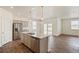 Modern kitchen featuring granite countertops, stainless steel appliances and gray cabinets at 845 Leeward St, Lochbuie, CO 80603