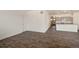 Open living space featuring wood-look floors, modern kitchen with island, and abundant natural light at 845 Leeward St, Lochbuie, CO 80603