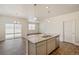 Modern kitchen featuring granite countertops, stainless steel appliances and gray cabinets at 845 Leeward St, Lochbuie, CO 80603