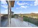 Balcony boasting panoramic views of scenic mountains, lush greenery, and other houses at 10592 Raven Run, Littleton, CO 80125