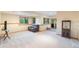 Open basement area with plush carpet, natural light, and a comfortable seating area, ready for relaxation and recreation at 10592 Raven Run, Littleton, CO 80125