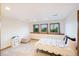 Bright bedroom featuring three windows, carpet floors, and neutral colors to complement a room at 10592 Raven Run, Littleton, CO 80125