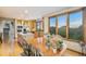 Dining room with oak cabinets and hardwood floors that features great views of the outside at 10592 Raven Run, Littleton, CO 80125